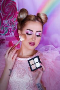 woman applying makeup on her face