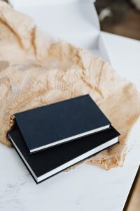black notebooks and packing stuff