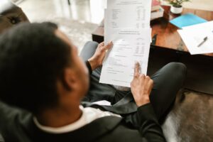 man pointing on documents