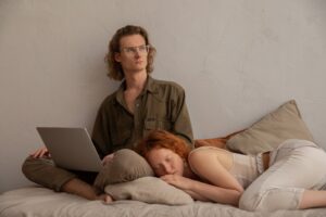 woman sleeping while lying on a man s lap